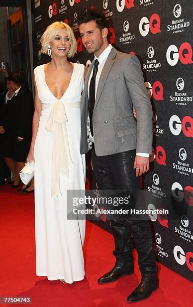 Model Lena Gercke arrives with Tariq Jay Khan for the GQ Men .